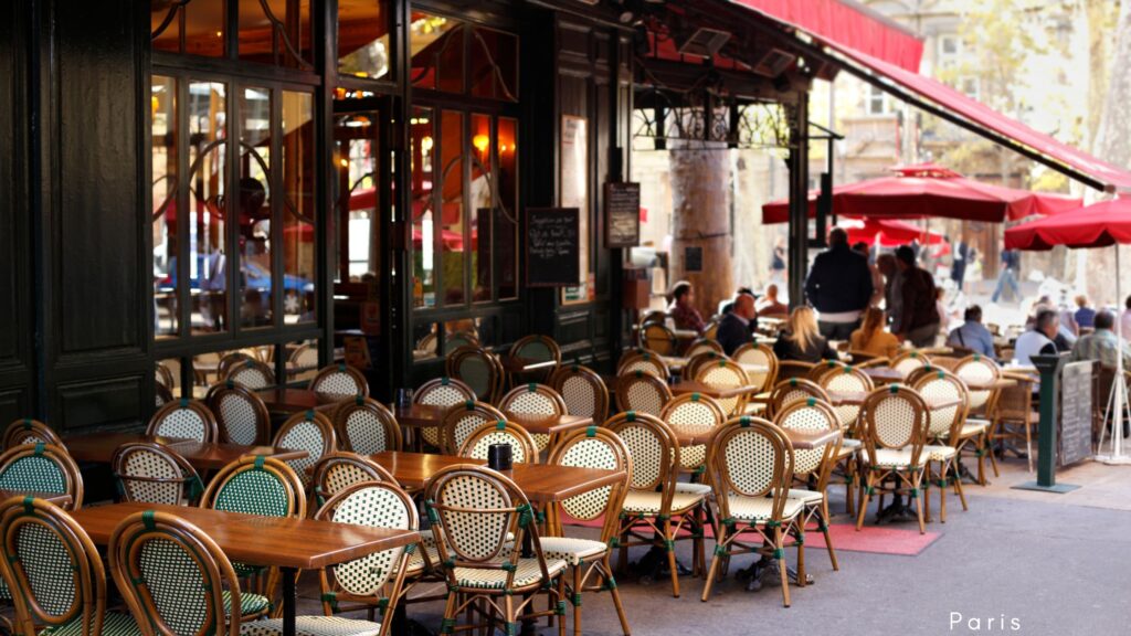 Quaint Parisian café with outdoor seating, showcasing the vibrant bistro culture